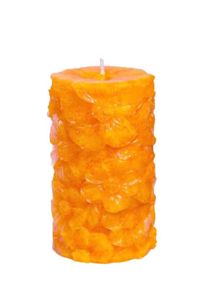 Scented candle with floral pattern