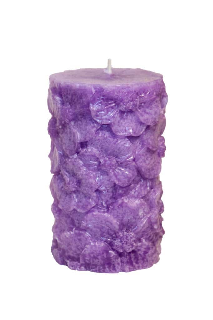 Scented candle with floral pattern